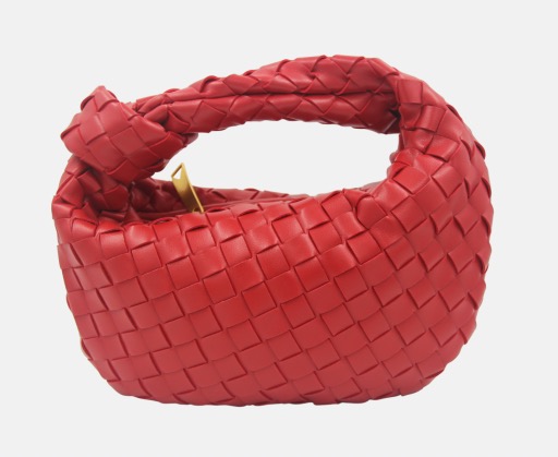 Rosalia knot handle handbag in red vegan leather with woven design, front view.