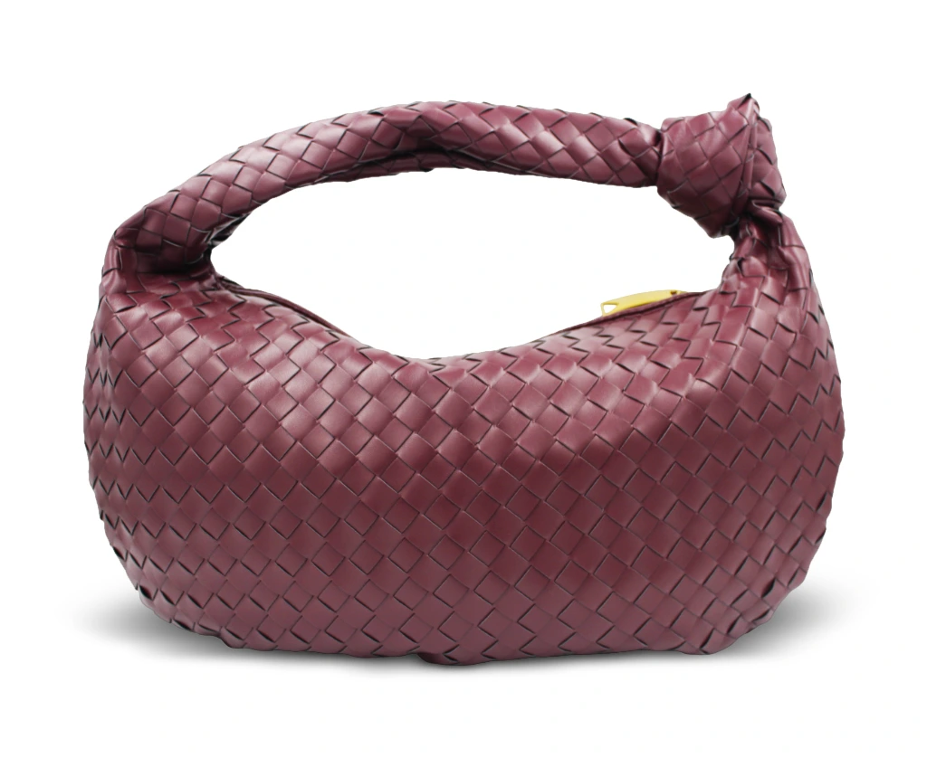 Blair large knot handle handbag in plum vegan leather with woven design, front view.