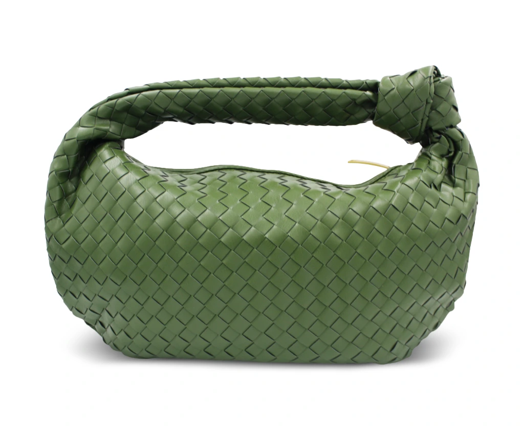 Charli large knot handle handbag in green vegan leather with woven design, front view.